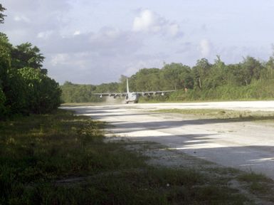 A C-130 Hercules turboprop aircraft from VMGR-152, 1ST Marine Air Wing, Okinawa, Japan, lands on the island of Peleliu during Exercise KOA THUNDER 2001. Marines from Aviation Support Element, Kaneohe Bay, Hawaii, 1ST Marine Air Wing, Okinawa, Japan, and 3rd Marines 7th Battalion, 29 Palms, California, participated in KOA THUNDER on the island of Guam from July 9 to July 14. The purpose of the exercise was to demonstrate the Marine Corps ability to deploy in the South Pacific from places other than Okinawa, Japan