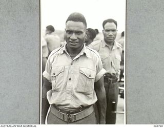 SYDNEY, NSW. 1944-01-26. "YARON" AN AUSTRALIAN AND NEW GUINEA ADMINISTRATION UNIT NATIVE ONE OF A PARTY WHO VISITED SYDNEY FOR A TOUR OF INSPECTION OF THE WAR FACTORIES