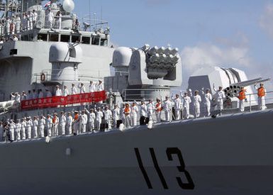 Chinese Peoples Liberation Army Navy Sailors from the Luhu Class (Type 052) Guided Missile Destroyer QINGDAO (DDG 113) man the rails as their ship departs Naval Station Pearl Harbor, Hawaii, on Sept. 10, 2006 after a Goodwill Visit. The visit provides an excellent opportunity to enhance cooperation between the two navies and underscores the United States commitment to supporting ongoing cooperative efforts in the Pacific Region. (U.S. Navy photo by CHIEF Mass Communication SPECIALIST David Rush) (Released)