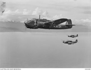 BEAUFORT BOMBER AIRCRAFT OF NO. 100 SQUADRON RAAF IN FLIGHT HEAD FOR WEWAK TO DESTROY JAPANESE FUEL AND AMMUNITION DUMPS. AIRCRAFT IN THE FOREGROUND IS CODED QH-X, SERIAL NO. A9-626, 2ND CLOSEST ..