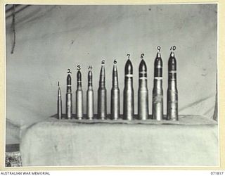 FINSCHHAFEN - SIO AREA, NEW GUINEA. 1944-03-31. JAPANESE AMMUNITION COLLECTED FROM DUMPS IN THE AREA BY THE CHIEF ENGINEERS'S BRANCH, HEADQUARTERS 2ND AUSTRALIAN CORPS. THE AMMUNITION DISPLAYED, ..