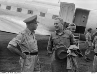 RABAUL, NEW BRITAIN. 1945-12-28. THE PRIME MINISTER OF AUSTRALIA, MR BEN CHIFLEY, ARRIVED BY PLANE TO VISIT MANY OF THE UNITS IN THE AREA. MR CHIFLEY CHATS WITH MAJOR GENERAL EATHER AT LAKUNAI ..