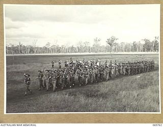 WONDECLA, QLD. 1944-04-15. QX18044 LIEUTENANT C.V. MARCH, LEFT (2), OFFICER- IN- CHARGE "A" COMPANY 2/1ST INFANTRY BATTALION GIVE "EYES RIGHT" AS "A" COMPANY MARCH PAST THE COMMANDING OFFICER, ..