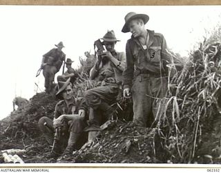 SHAGGY RIDGE, NEW GUINEA. 1943-12-27. TROOPS OF THE 2/16TH AUSTRALIAN INFANTRY BATTALION, 21ST AUSTRALIAN INFANTRY BRIGADE ON THE RAZOR BACK OF THE "PIMPLE" AFTER THEIR SUCCESSFUL ATTACK ON THE ..