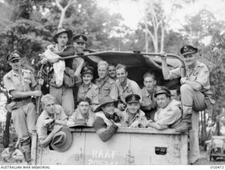VIVIGANI, GOODENOUGH ISLAND, PAPUA. 1944-01-17. INFORMAL GROUP PORTRAIT OF CREWS OF NO. 100 (BEAUFORT) SQUADRON RAAF IN THE BACK OF A TRUCK ON THEIR WAY TO BE INTERROGATED AFTER RETURNING FROM A ..