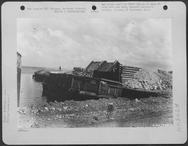 Dumping Rubbish In Barge Which Will Dispose Of Trash At Sea, Saipan, Marianas Islands. (U.S. Air Force Number A64130AC)