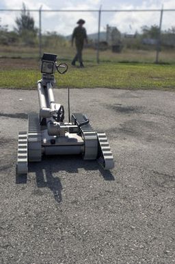 An iRobot PackBot EOD Robot is demonstrated at the Explosive Ordnance Disposal Mobile Unit 5 (EODMU-5) compound at Santa Rita Naval Base, Guam (GU), during the Annual Multi-national Explosive Ordnance Disposal (EOD) Exercise known as TRICARB 2006." The Exercise brings together EOD Units from the US, Australia and Singapore