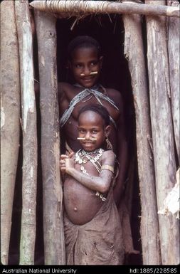 Febi girls at the doorway of their house