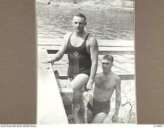 1943-05-24. NEW GUINEA. CORPORAL KEV. HORN, QUEENSLAND, BACKSTROKE CHAMPION FOR SIX YEARS, LEAVING THE WATER AFTER HAVING COMPETED IN AN EVENT AT A COMBINED SERVICES SWIMMING CARNIVAL IN NEW ..