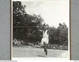 ELA BEACH, NEW GUINEA. 1944-01-01. Q1607 SIGNALMAN G. E. STRANGE OF THE 5TH DIVISION SIGNALS WINNING THE 1 MILE OPEN CHAMPIONSHIP AT THE ALLIED SERVICES GRAND SPORTS CARNIVAL