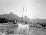 Avarua (Cook Islands), sailboat on water with mountains in distance