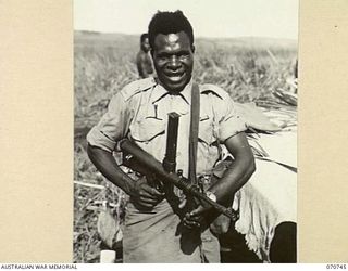 KELANOA, NEW GUINEA. 1944-03-04. 480 CORPORAL SALA, MM, "A" COMPANY, 1ST PAPUAN INFANTRY BATTALION. "A" COMPANY ARE PAST MASTERS IN JUNGLE WARFARE. LED BY EXPERT AUSTRALIAN OFFICERS AND NON ..