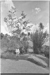 Edwin Cook next to a gate, entrance to a dance ground