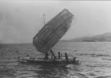 Natives on a homemade sailboat; Natives on a homemade sailboat