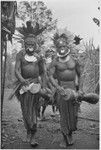 Pig festival, wig ritual: decorated men solemnly beat kundu drums