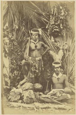 Portrait of Piepe and Harrie, with Kanak artefacts, New Caledonia, ca. 1870 / photographed by W. & E. Dufty