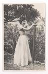 Evelyn Murray's secretary in the garden at Government House, Port Moresby, c1949