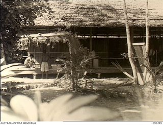 Hombu Hombu, New Georgia Island. 1945-03-28. Native members of the British Solomon Islands Defence Force at work building a new administrative building at their camp site