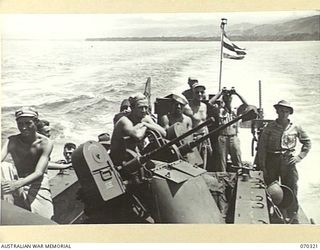 YAGOMAI, NEW GUINEA, 1944-02-10. MEMBERS OF THE UNITED STATES 476TH ANTI AIRCRAFT ARTILLERY BATTALION PICTURED ON A LANDING CRAFT, MECHANISED (LCM) "FLACK" BOAT