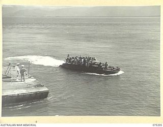 LAE, NEW GUINEA. 1944-08-14. SISTERS FROM THE 128TH GENERAL HOSPITAL, PORT MORESBY, MOVING ASHORE IN AUSTRALIAN ARMY "DUKWS" AFTER DISEMBARKING FROM THE 2/1ST HOSPITAL SHIP MANUNDA