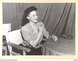 TOROKINA, BOUGAINVILLE, 1945-08-16. MISS PEGGY SHEA, A MEMBER OF THE GRACIE FIELDS CONCERT PARTY MAKING UP IN HER DRESSING ROOM AT HEADQUARTERS 2 CORPS. SHEA IS A MEMBER OF THE J.C. WILLIAMSON ..