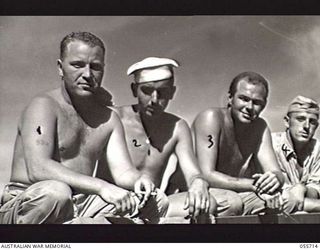 NASSAU BAY, NEW GUINEA. 1943-08-16. TROOPS OF THE 542ND ENGINEER BOAT AND SHORE REGIMENT, UNITED STATES FORCES. LEFT TO RIGHT: 32291866 PRIVATE (PTE) C. WOODLEY; 11054962 PTE G. F. WHITE; 39001363 ..