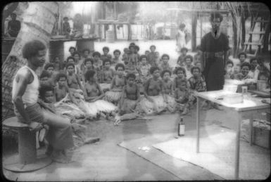Meeting in a village (also taking blood films for malaria diagnosis) : D'Entrecasteaux Islands, Papua New Guinea, 1956-1959 / Terence and Margaret Spencer
