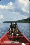 Three men on canoe