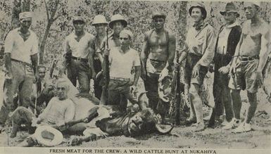 Hunters pose with their trophy after a successful hunt on Nukahiva for fresh meat for the Cap Pilar