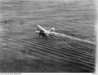 SOLOMON SEA AREA. 1944-01-27. THE CATALINA FLYING BOAT AIRCRAFT WHICH SEARCHED 400 SQ MILES OF SEA, TAXIES TO RESCUE WARRANT OFFICER J. E. C. "SHORTY" ARTHUR, BURNIE OF TAS, A PILOT OF NO. 76 ..