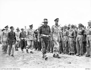 Major General Kenneth William Eather (third from front), General Officer Commanding 11 Division, and Lieutenant Colonel Woo Yien (left), commander of Chinese Army troops in New Britain, inspecting ..