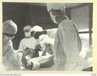 BOUGAINVILLE ISLAND. 1945-01-23. Q268714 PRIVATE K.J. LEECH, "D" COMPANY, 31/51ST INFANTRY BATTALION WHO LOST A LEG IN THE FIGHTING IN THE PIATERAPAIA AREA BEING OPERATED ON IN THE THEATRE OF THE ..