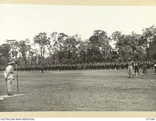 LAE, NEW GUINEA. 1944-03-08. VX20308 MAJOR-GENERAL F.H. BERRYMAN, CBE, DSO (1), GENERAL OFFICER COMMANDING 2ND AUSTRALIAN CORPS, ADDRESSING TROOPS OF THE 29TH INFANTRY BRIGADE AFTER THE MARCH PAST. ..