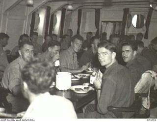 AT SEA, 1944-05-12. OTHER RANKS AT MESS ABOARD THE TROOPSHIP ORMISTON DURING THE JOURNEY FROM PORT MORESBY TO LAE