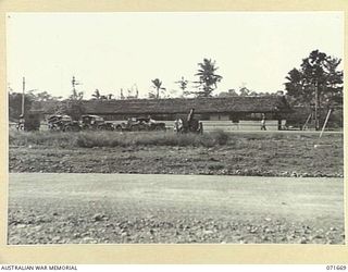 LAE, NEW GUINEA. 1944-03-24. THE ADMINISTRATION BUILDINGS, INTELLIGENCE BRANCH, G BRANCH AND THE CAMP COMMANDANT'S BRANCH AT HEADQUARTERS, LAE BASE SUB-AREA. (JOINS WITH PHOTOGRAPHS NUMBERED 071666 ..