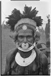 Pig festival, singsing, Tsembaga hosts Tsengamp: man wearing shell valuables, marsupial fur and feather headdress