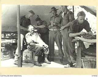 HANSA BAY, NEW GUINEA. 1944-07-29. PATIENTS RECEIVING TREATMENT AT THE REGIMENTAL AID POST OF THE 30TH INFANTRY BATTALION IN THE POTSDAM PLANTATION. IDENTIFIED PERSONNEL ARE:- WX39515 PRIVATE T.J. ..