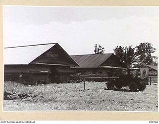 LAE, NEW GUINEA. 1945-11-12. EXTERIOR OF 8 SECTION AUSTRALIAN OFFICERS' SHOP AND TAILORING DEPARTMENT