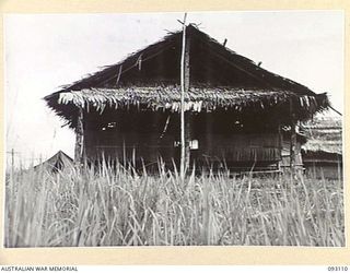 CAPE WOM, WEWAK AREA, NEW GUINEA, 1945-06-13. THE MESS HUT AND LIVING QUARTERS OF MAJ-GEN J.E.S. STEVENS, GOC 6 DIVISION AT HQ 6 DIVISION