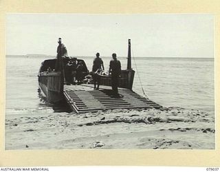 TSIMBA AREA, BOUGAINVILLE ISLAND. 1945-02-06. STRETCHER BEARERS, LOADING WOUNDED TROOPS OF THE 31/51ST INFANTRY BATTALION ABOARD A LANDING BARGE FOR TRANSPORT TO THE ADVANCE DRESSING STATION AT ..