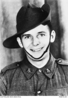 Studio portrait of NX53269 Gunner (Gnr) Eric Kenneth Triggs, 17 Anti Tank Battery, of Tuggerah, NSW. The name Eric Kenneth Triggs was an alias used because he was under age at the time of ..