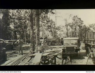 Apoka Valley, Papua. 1943-02. A Jeep powered sawmill cutting timber for the 750-bed Port Moresby Evacuation Hospital erected on the site by the 135th Medical Regiment, U.S. Army. Construction began ..