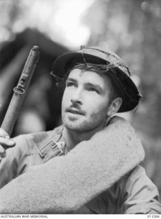 EORA CREEK, PAPUA. C. 1942-09-01. MELBOURNE CORPORAL J. A. CANTY OF THE A.M.F. 39TH BATTALION JUST BEFORE GOING INTO ACTION AGAINST THE JAPANESE AT ISURAVA IN THE KOKODA AREA. (PHOTOGRAPHER DAMIEN ..