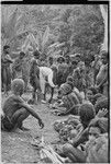 Kwima: Ann Rappaport exchanges salt for garden produce, watched by crowd