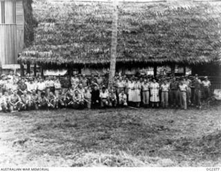 MADANG, NEW GUINEA. 1944-12-19. GROUP OF CHURCH OF ENGLAND COMMUNICANTS AT THE FIRST COMMUNION SERVICE AT THE RAAF MEMORIAL CHAPEL AT THE FORWARD RAAF BASE. INCLUDED IN THE CONGREGATION WERE NATIVE ..