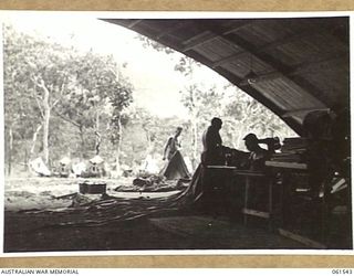 17 MILE, PORT MORESBY AREA, NEW GUINEA. 1943-12-13. TENT REPAIR SECTION OF THE RETURNED STORES DEPOT, 10TH AUSTRALIAN ADVANCED ORDNANCE DEPOT WHERE DAMAGED TENTS AND CANVAS EQUIPMENT IS REPAIRED