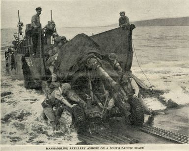 Manhandling artillery ashore on a South Pacific beach