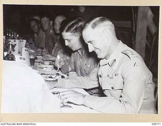 LAE, NEW GUINEA, 1945-12-01. BRIGADIER S.P. MCGRATH, DEPUTY DIRECTOR OF SUPPLIES AND TRANSPORT, FIRST ARMY (1) ATTENDING A FORMAL MESS AT THE OFFICERS' AND SERGEANTS' MESSES, 2/1 BASE WORKSHOP, ON ..