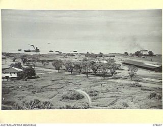 LAE. NEW GUINEA. 1944-07. ONE OF A NUMBER OF PHOTOGRAPHS TAKEN TO GIVE A 120 PANORAMIC VIEW OF THE TOWN OF LAE. TO JOIN TO PHOTOGRAPHS NO. 74635, 74636, 74638, 74639 AND 74640