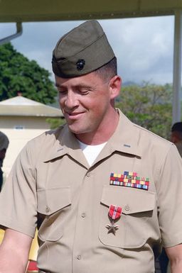 Lieutenant (LT) Edwards, Headquarters Service Battalion, 11th Counter Intelligence Team, receives a Bronze Star medal for gallantry in action while serving with the Joint Task Force in Lebanon from October 24, 1983 to April 26, 1984. LT Edwards interrogated Lebanese rebels while under enemy fire